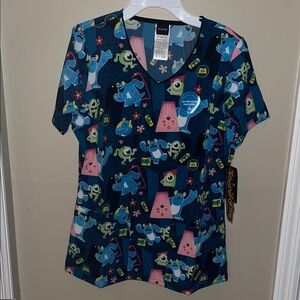 New with tags Monsters Inc Scrub Top, size XS